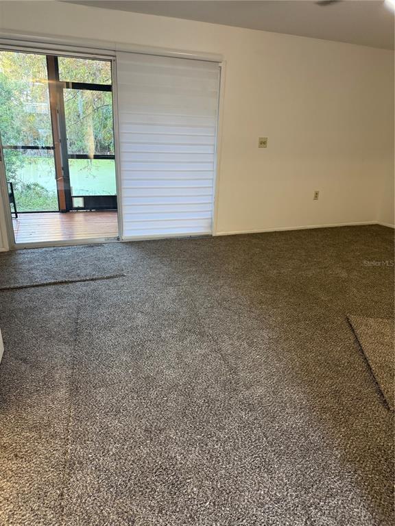 7027 Paul Revere Terrace New Port Richey, FL 34653 - Photo 7 of 20 a view of an empty room with a window