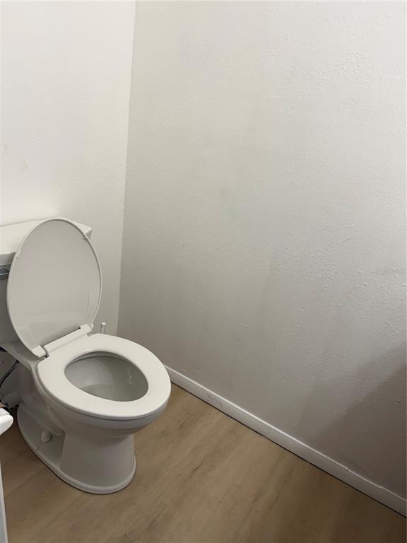 7027 Paul Revere Terrace New Port Richey, FL 34653 - Photo 10 of 20 a white toilet sitting next to a white sink