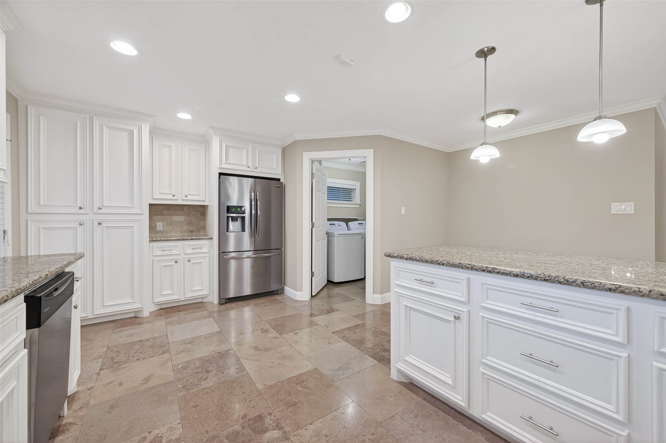 5323 Briarbend Drive Houston, TX 77096 - Photo 12 of 38 a large kitchen with cabinets and stainless steel appliances