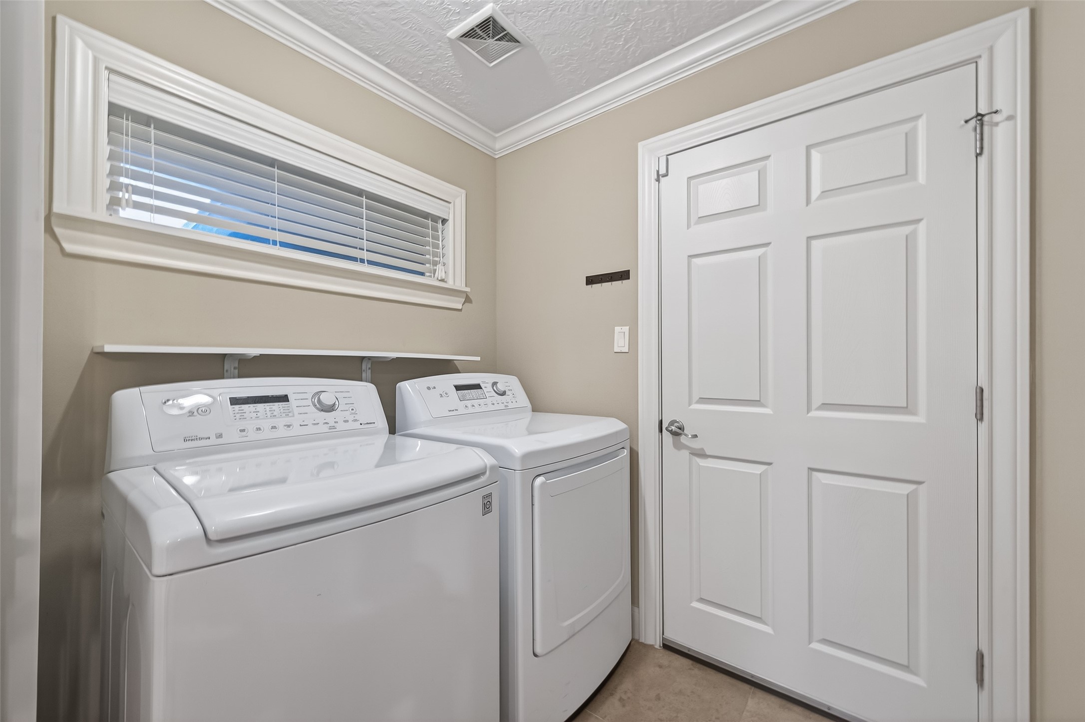 5323 Briarbend Drive Houston, TX 77096 - Photo 16 of 38 a utility room with dryer and washer