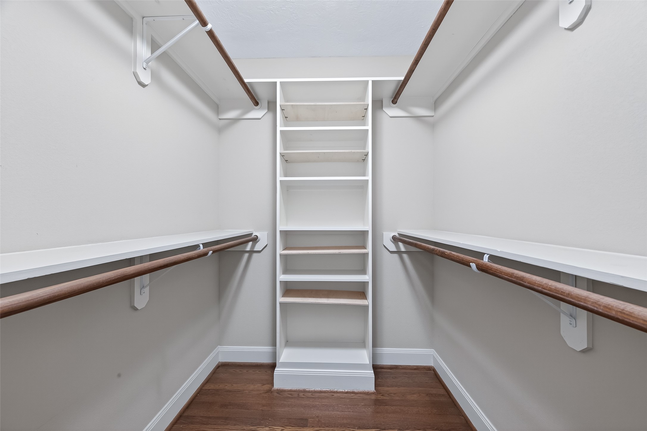 5323 Briarbend Drive Houston, TX 77096 - Photo 28 of 38 a view of walk in closet with empty racks