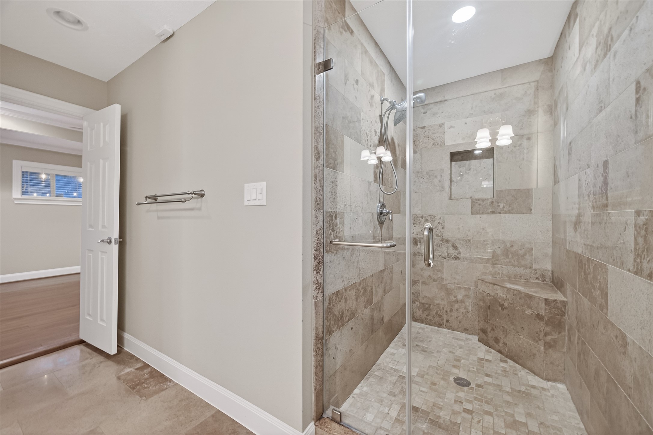 5323 Briarbend Drive Houston, TX 77096 - Photo 30 of 38 a bathroom with a glass shower door