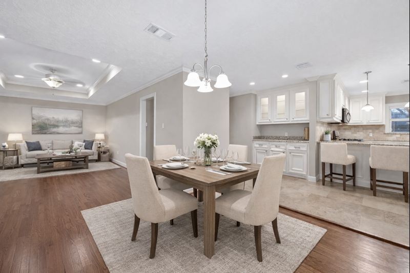 5323 Briarbend Drive Houston, TX 77096 - Photo 5 of 38 a view of a dining room with furniture and wooden floor