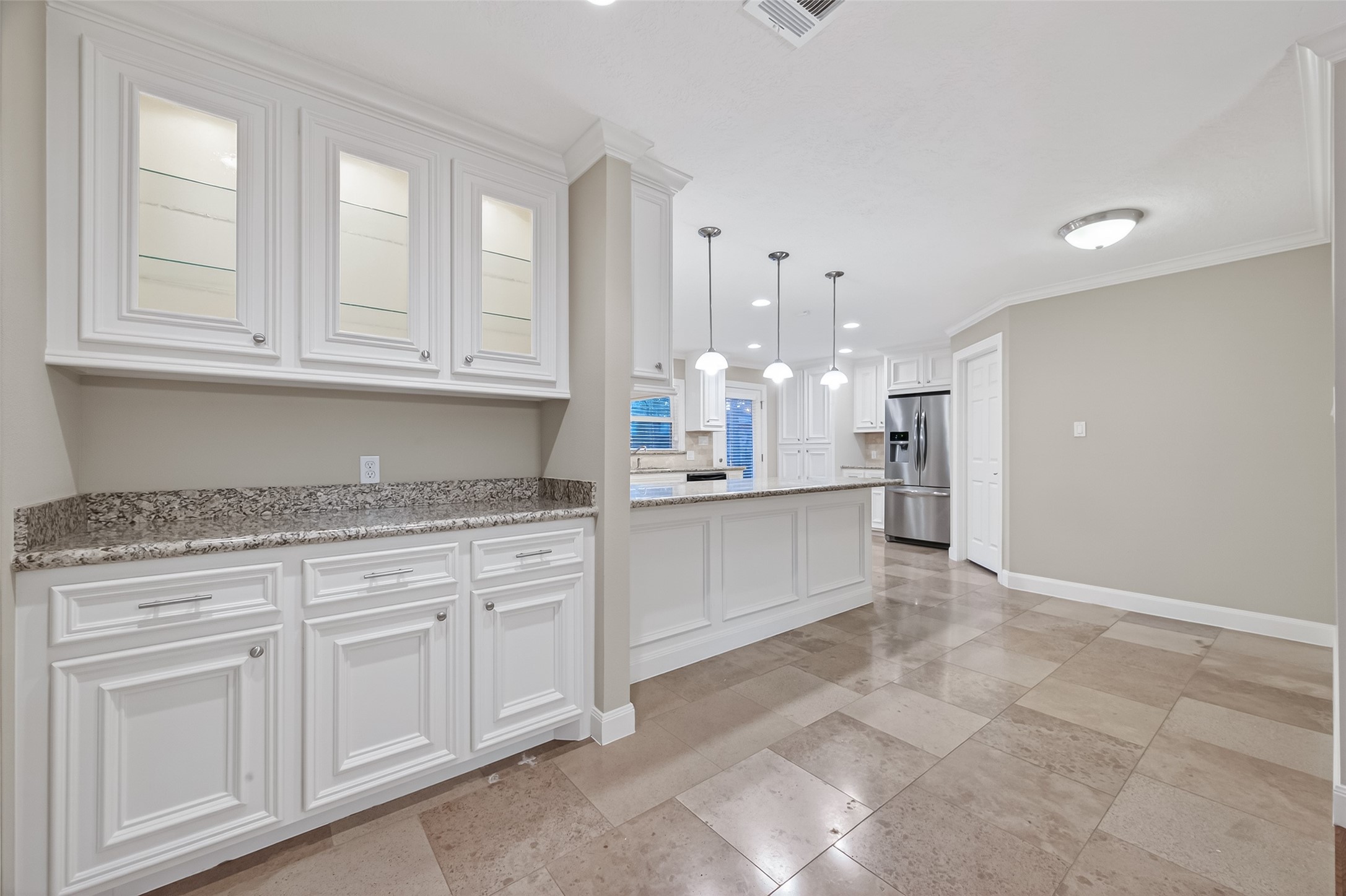 5323 Briarbend Drive Houston, TX 77096 - Photo 7 of 38 a kitchen with white cabinets granite counter tops and a sink