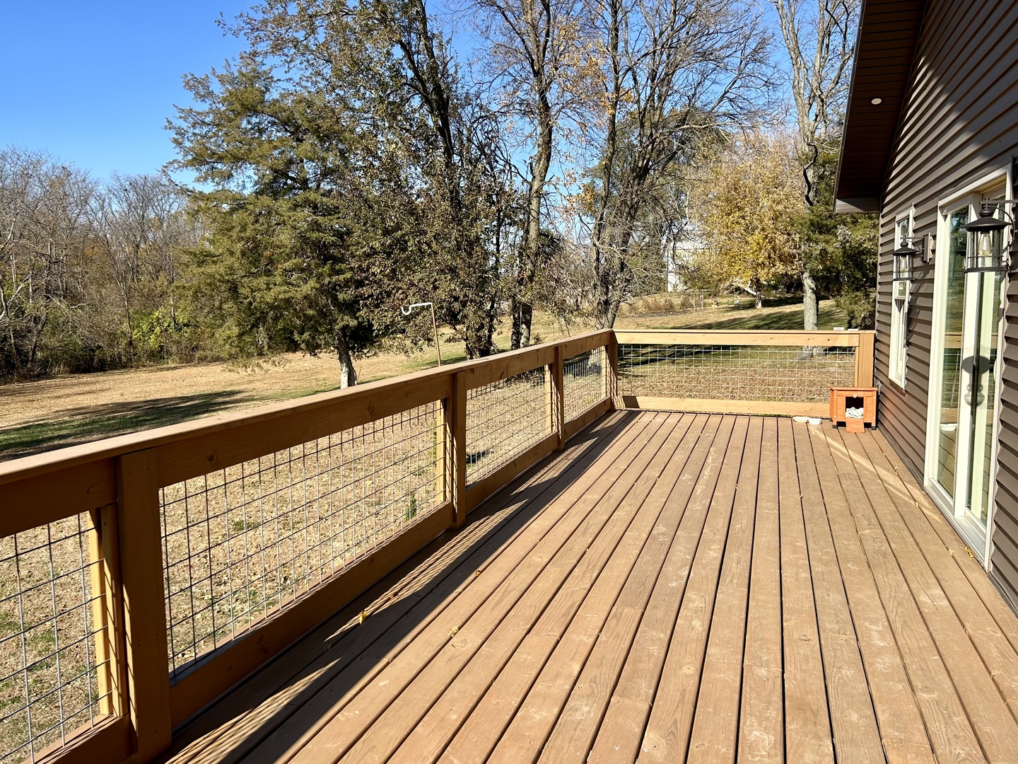 2345 East 275th Road Oglesby, IL 61348 - Photo 15 of 20 a view of balcony with wooden floor and trees