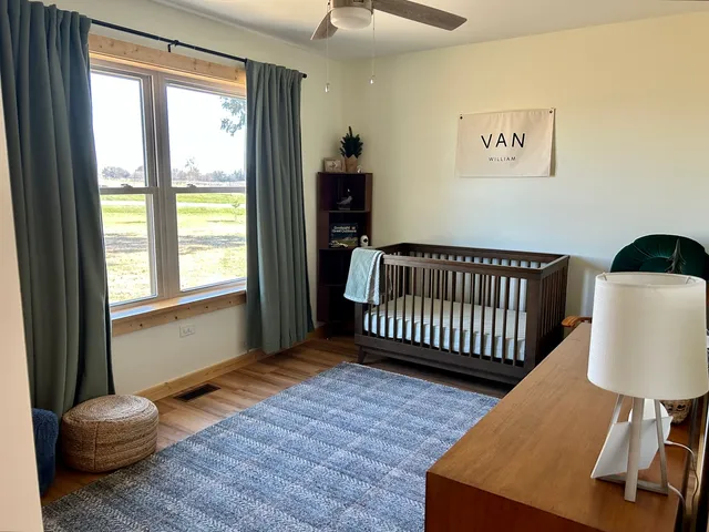 a bedroom with furniture and a window