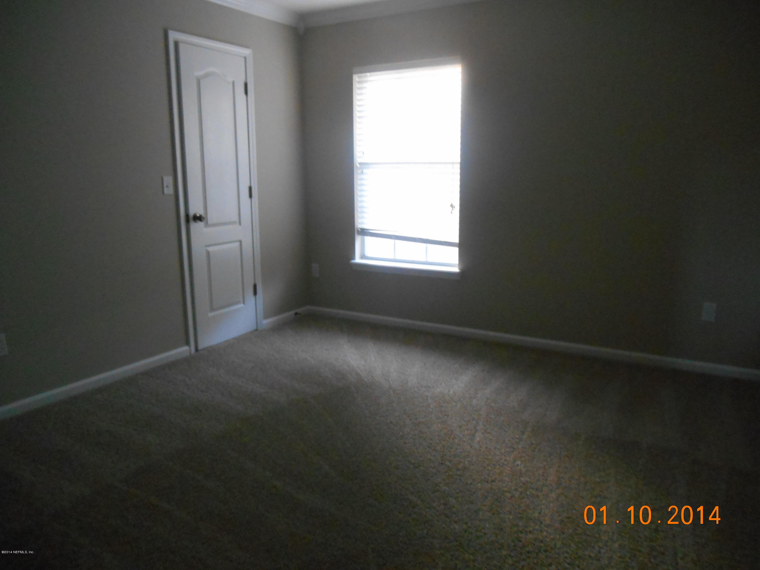 97226 Castle Ridge Drive Yulee, FL 32097 - Photo 12 of 15 an empty room with a window