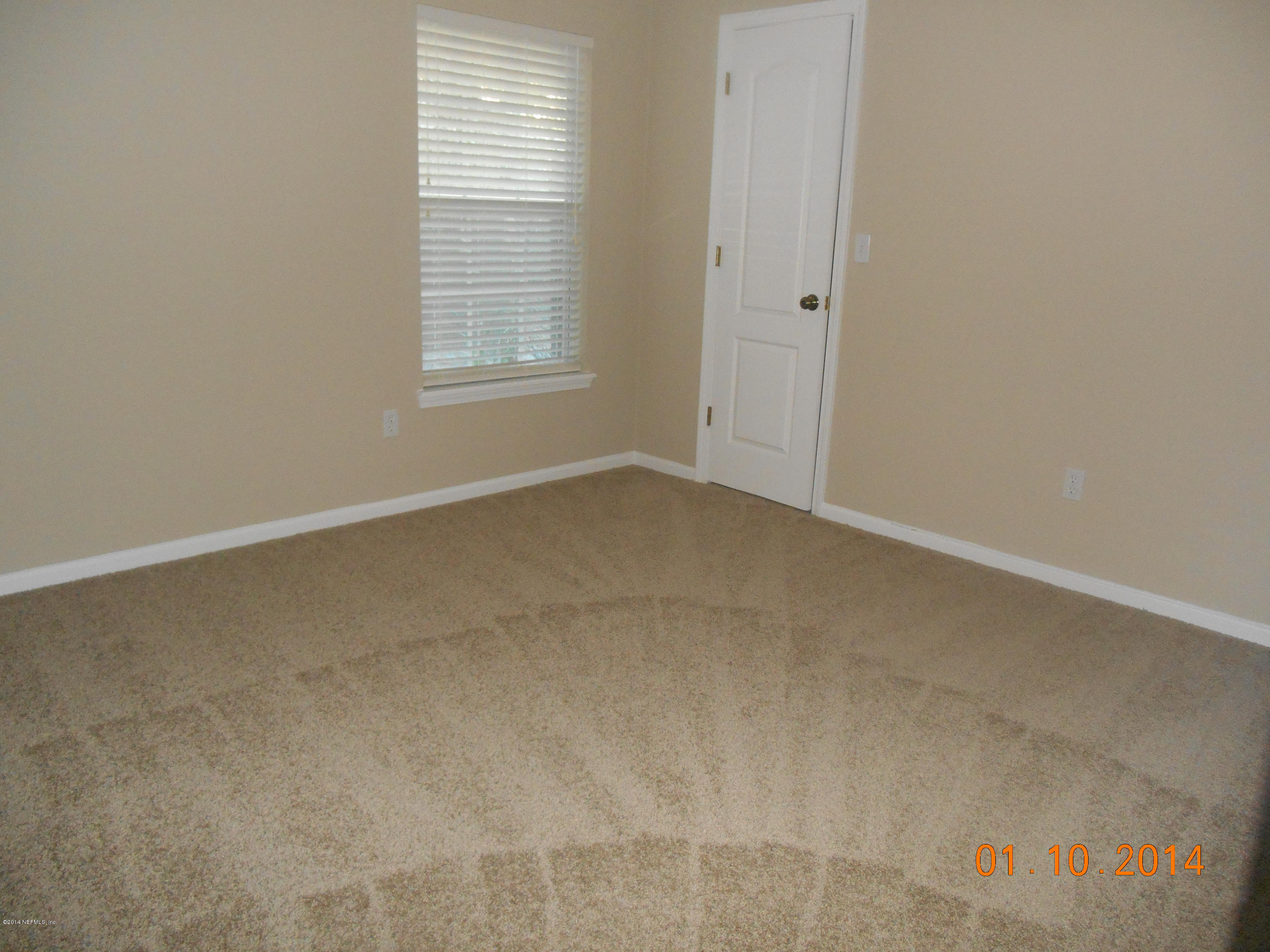 97226 Castle Ridge Drive Yulee, FL 32097 - Photo 13 of 15 an empty room with windows