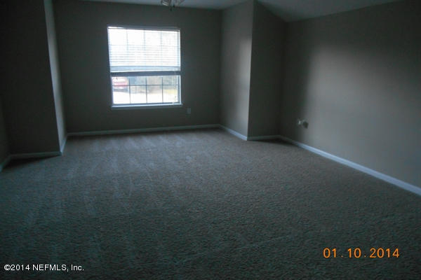 97226 Castle Ridge Drive Yulee, FL 32097 - Photo 14 of 15 an empty room with two window