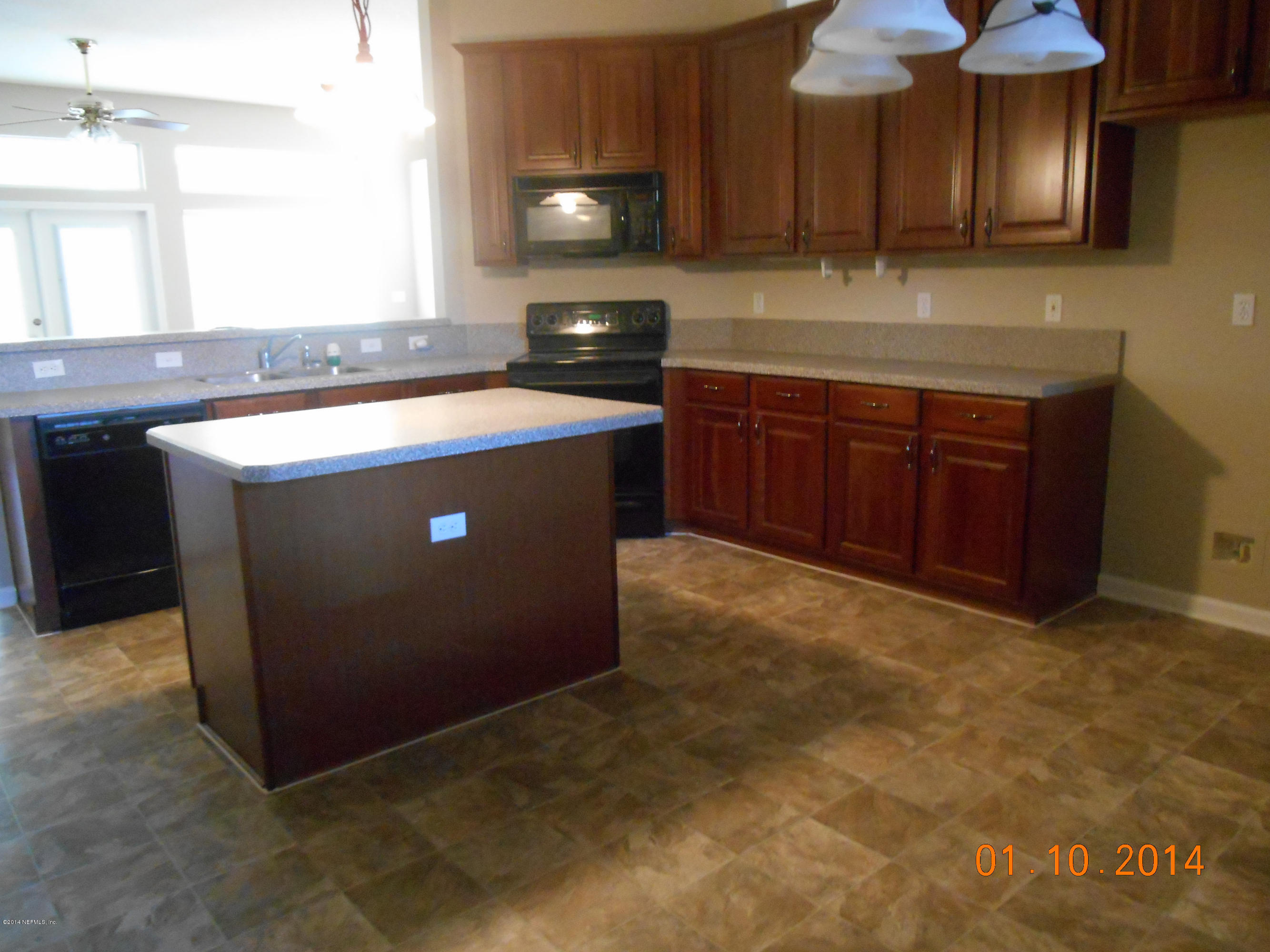 97226 Castle Ridge Drive Yulee, FL 32097 - Photo 6 of 15 a kitchen with a cabinets and a sink