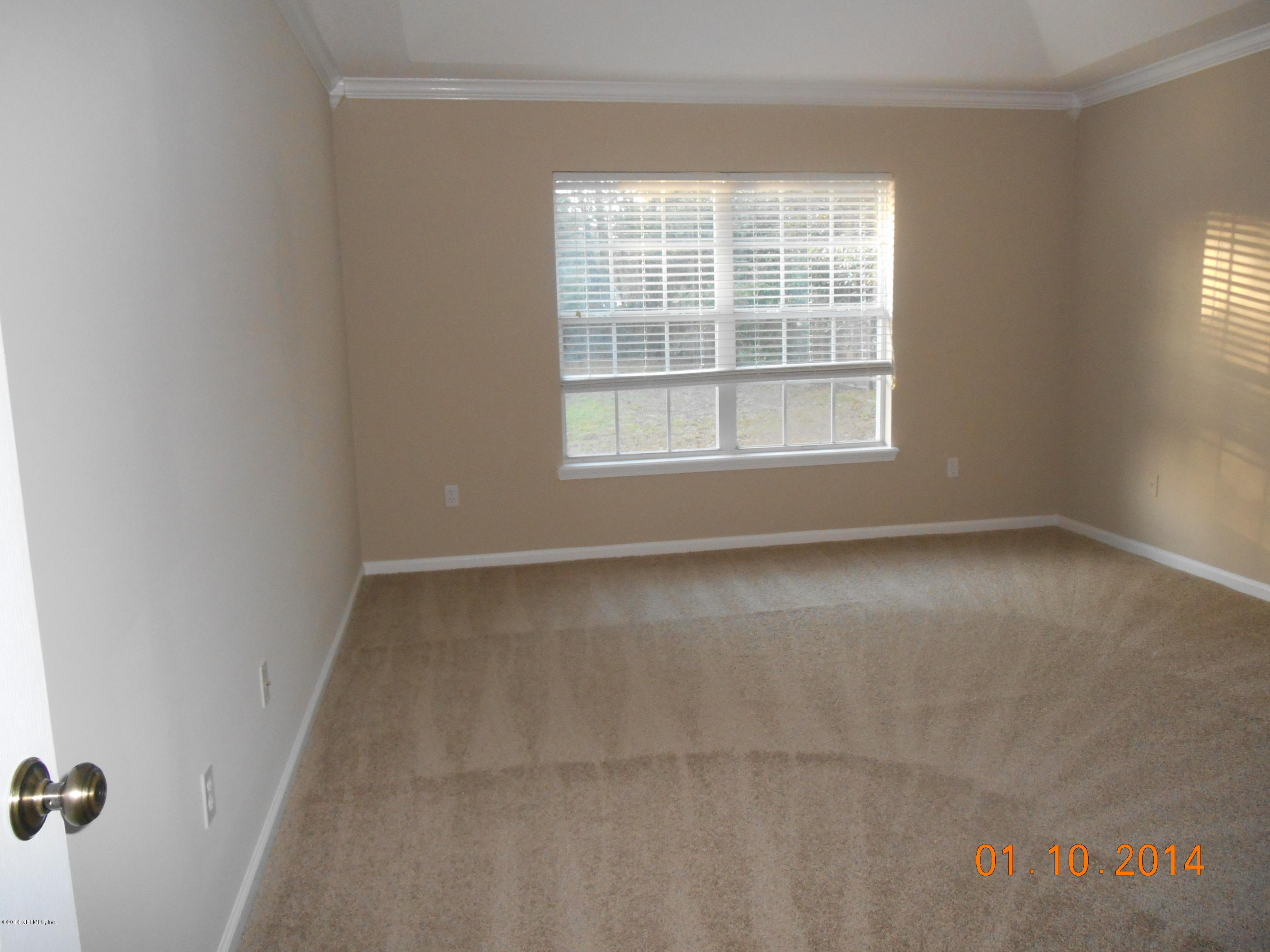 97226 Castle Ridge Drive Yulee, FL 32097 - Photo 10 of 15 an empty room with a window