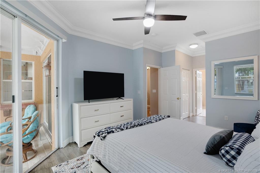 3532 Southwest Margela Street Port St. Lucie, FL 34953 - Photo 15 of 29 a bedroom with a bed and a flat screen tv