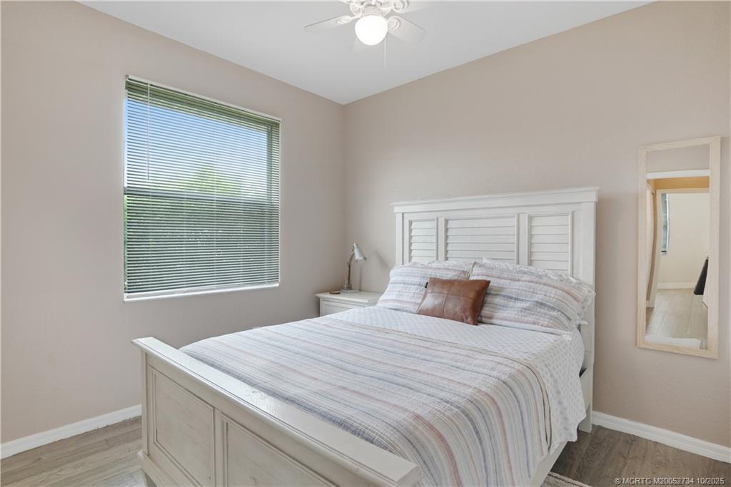 3532 Southwest Margela Street Port St. Lucie, FL 34953 - Photo 19 of 29 a bedroom with a bed and a window