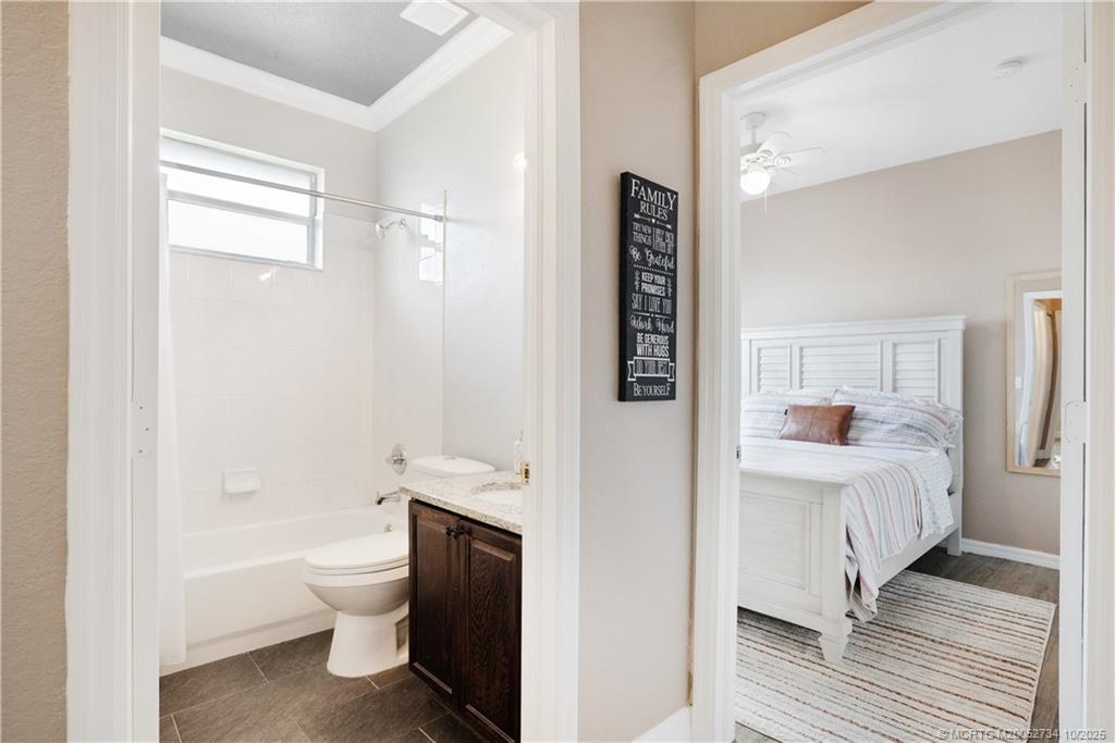 3532 Southwest Margela Street Port St. Lucie, FL 34953 - Photo 20 of 29 a spacious bathroom with a bathtub and a toilet