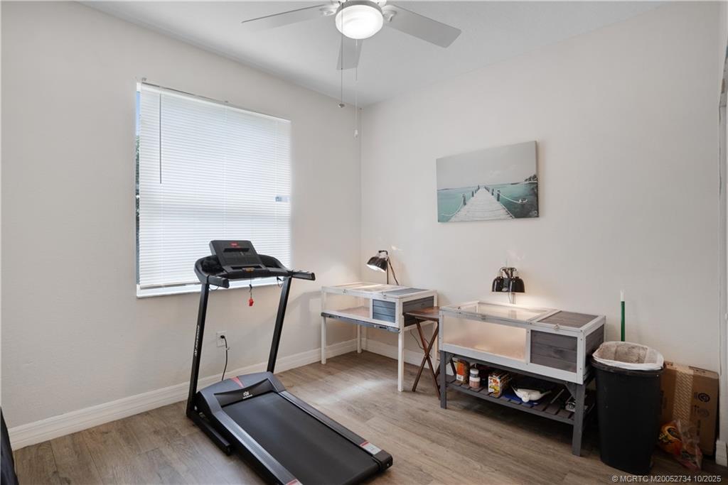 3532 Southwest Margela Street Port St. Lucie, FL 34953 - Photo 21 of 29 a room with a desk and gym equipment