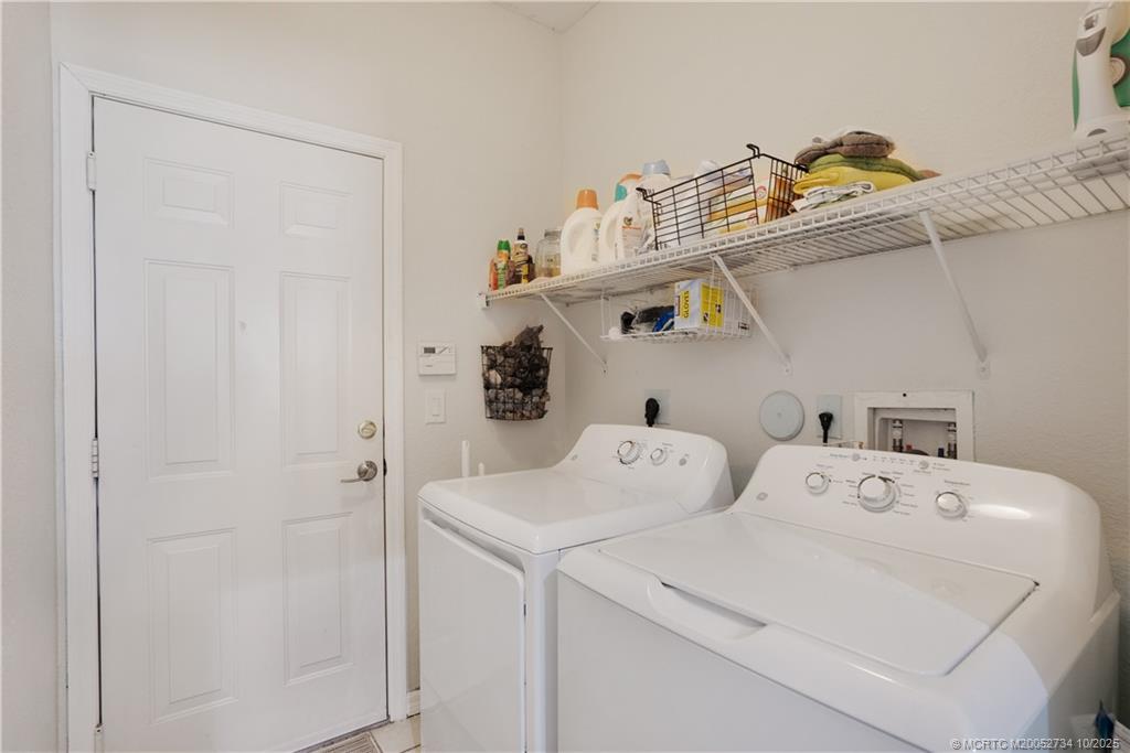 3532 Southwest Margela Street Port St. Lucie, FL 34953 - Photo 22 of 29 a utility room with dryer and washer