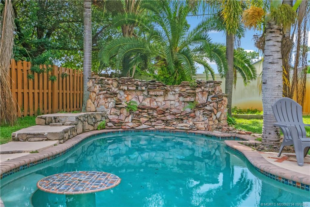 3532 Southwest Margela Street Port St. Lucie, FL 34953 - Photo 26 of 29 a view of a backyard with a garden