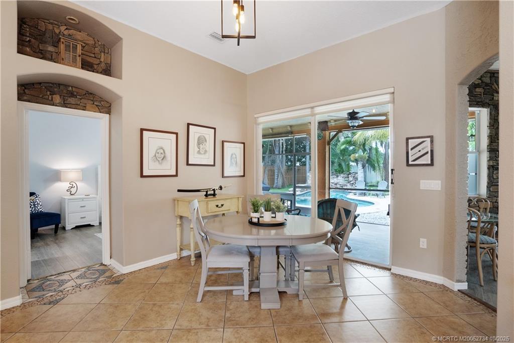 3532 Southwest Margela Street Port St. Lucie, FL 34953 - Photo 7 of 29 a dining room with furniture and window