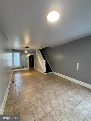 a view of empty room with windows