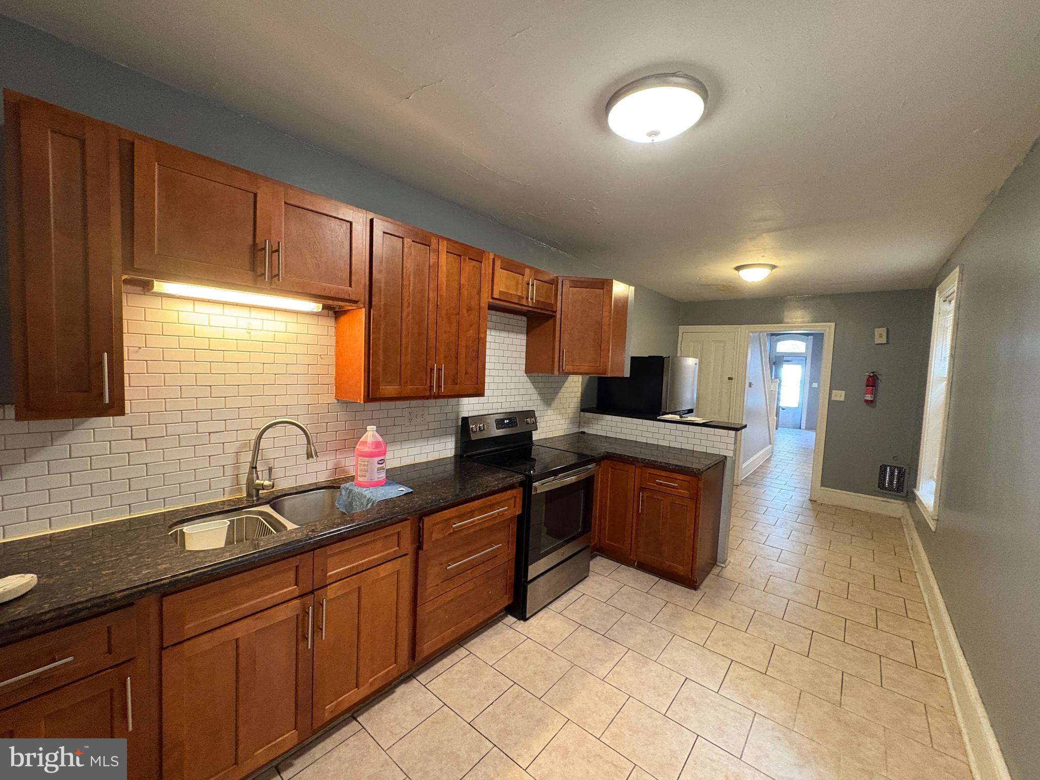 1512 Haak Street Reading, PA 19602 - Photo 8 of 10 a large kitchen with lots of counter space and a sink