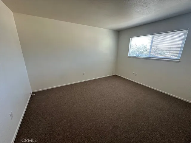 a view of a backyard of the house