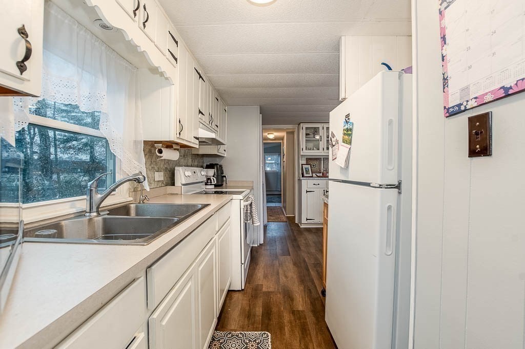 5 Timber Lane Wareham, MA 02571 - Photo 15 of 31 a kitchen with refrigerator cabinets and a sink