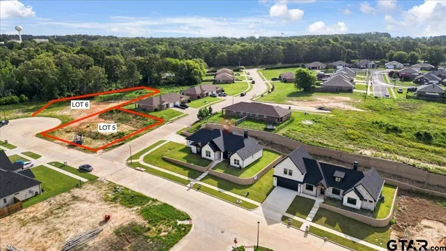 an aerial view of swimming pool with a patio