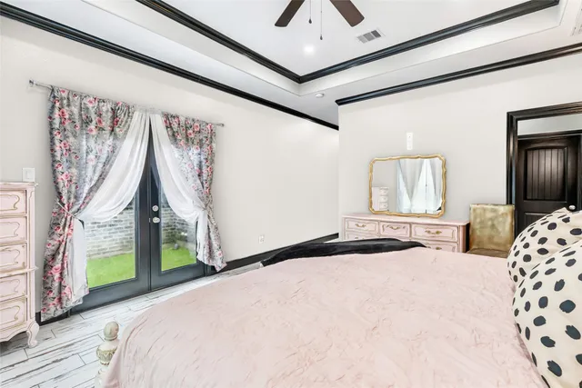 a en suite bathroom with a granite countertop sink and a mirror