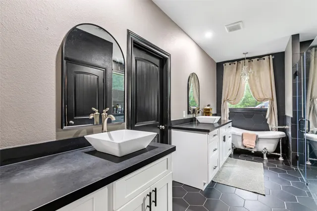 a living room with a window and a chandelier