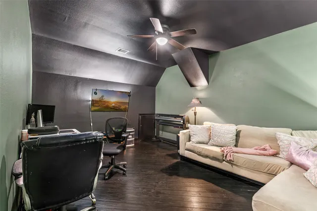 a en suite bathroom with a granite countertop sink and a mirror