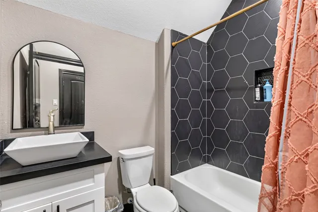 a view of a house with a yard and sitting area