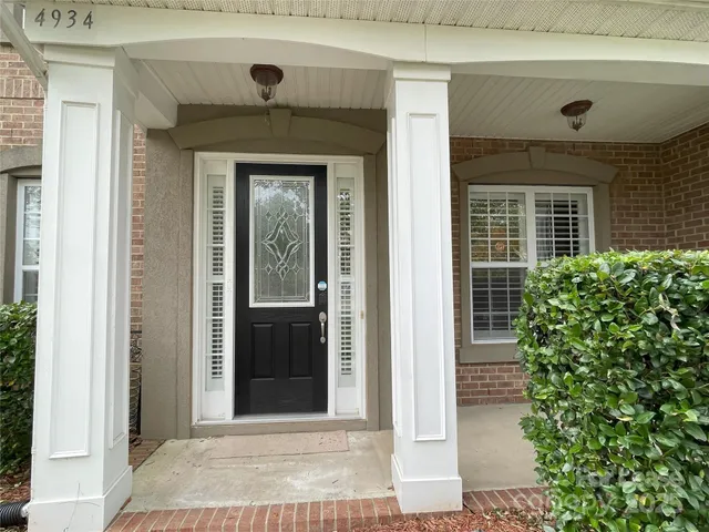 a front view of a house with a door