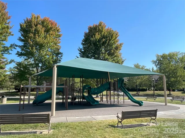 a view of a house with backyard porch and sitting area