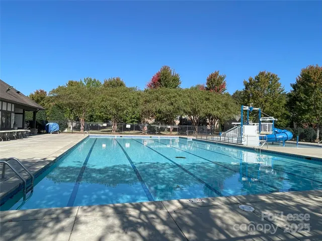a view of yard with swimming pool