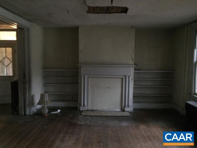31 Orchard Road Lovingston, VA 22949 - Photo 15 of 17 a view of an empty room with a fireplace