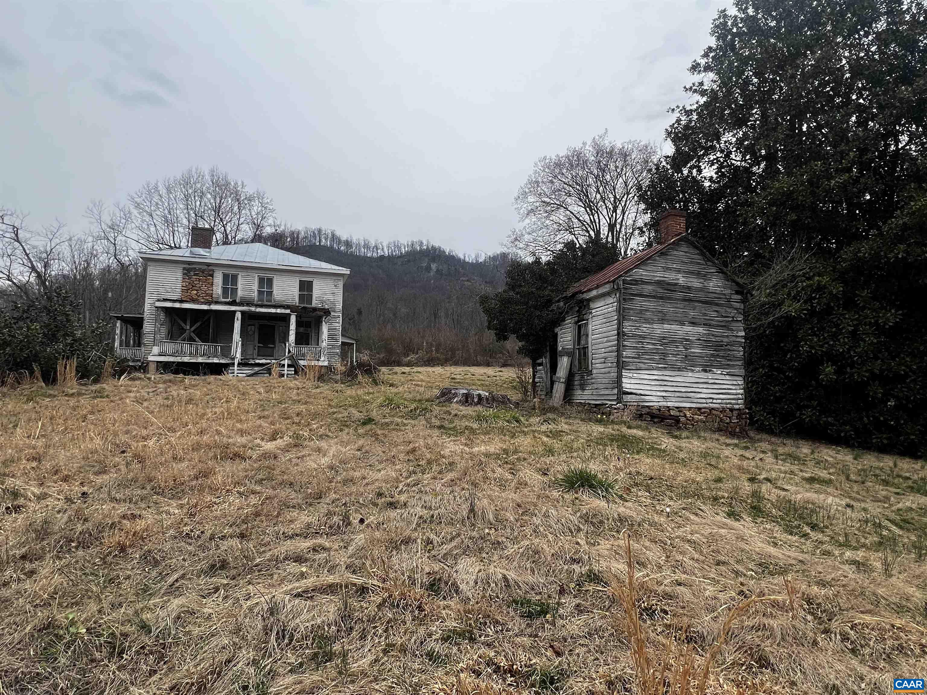 31 Orchard Road Lovingston, VA 22949 - Photo 9 of 17 a front view of a house with a yard and garage