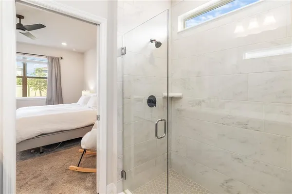 a view of a livingroom and a hallway