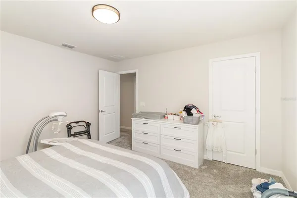 a bathroom with double vanity sink and a mirror