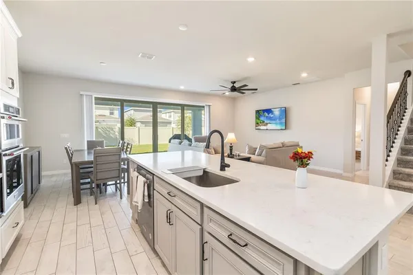 a kitchen with a table and chairs in it