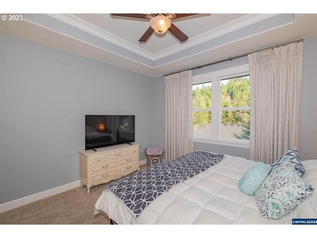 341 Boulder Ridge Drive Sweet Home, OR 97386 - Photo 12 of 32 a bedroom with a bed and a flat screen tv