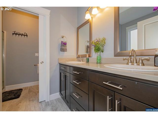 341 Boulder Ridge Drive Sweet Home, OR 97386 - Photo 13 of 32 a bathroom with a sink and a mirror