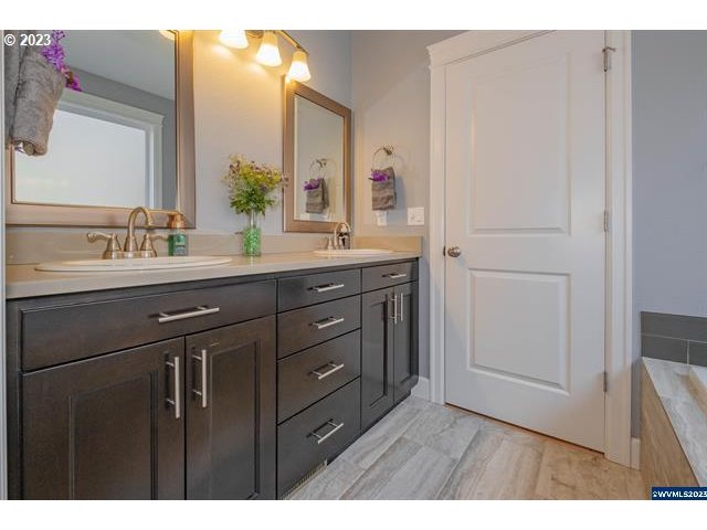 341 Boulder Ridge Drive Sweet Home, OR 97386 - Photo 15 of 32 a bathroom with a double vanity sink and mirror