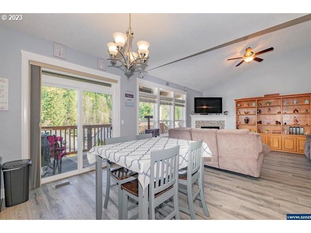 341 Boulder Ridge Drive Sweet Home, OR 97386 - Photo 27 of 32 a view of a dining room with furniture window and wooden floor