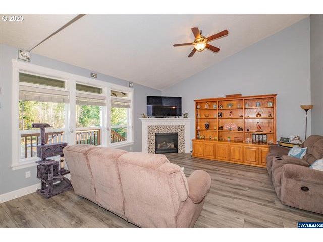 341 Boulder Ridge Drive Sweet Home, OR 97386 - Photo 30 of 32 a living room with furniture fireplace and a large window