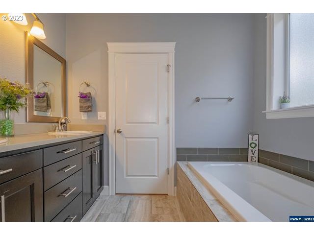 341 Boulder Ridge Drive Sweet Home, OR 97386 - Photo 31 of 32 a bathroom with a sink a vanity and a mirror