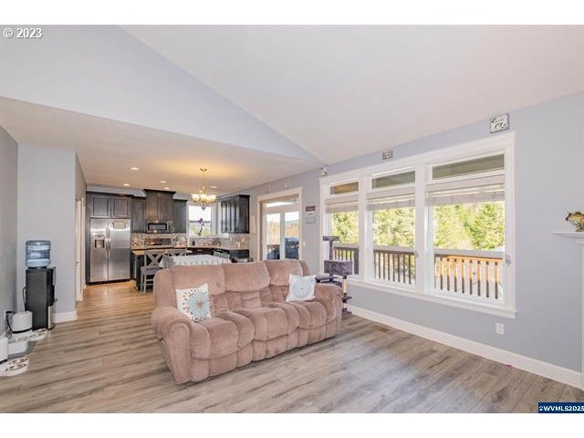 341 Boulder Ridge Drive Sweet Home, OR 97386 - Photo 32 of 32 a living room with furniture and a wooden floor