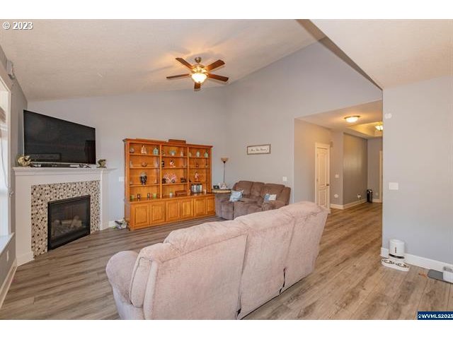 341 Boulder Ridge Drive Sweet Home, OR 97386 - Photo 4 of 32 a bedroom with furniture and a fireplace