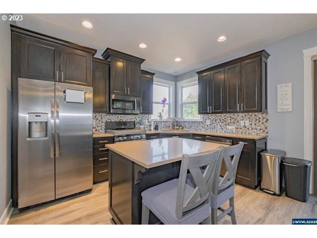 341 Boulder Ridge Drive Sweet Home, OR 97386 - Photo 5 of 32 a kitchen with kitchen island a counter top space appliances and a sink