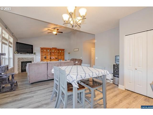 341 Boulder Ridge Drive Sweet Home, OR 97386 - Photo 6 of 32 a view of a dining room with furniture wooden floor and chandelier
