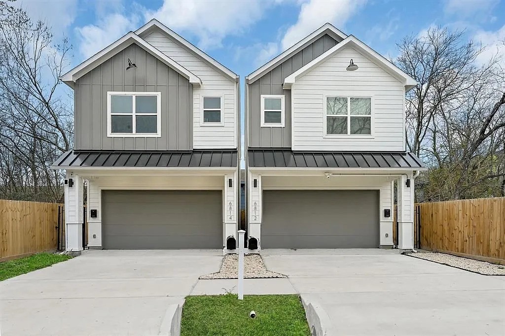 6814 Burkett Street, Unit B Houston, TX 77021 - Photo 1 of 30 a front view of a house with yard and parking